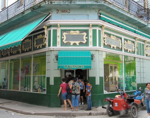 Cubans lining up to shop at La Francia in Centro, a store that sells blouses, hairdryers, washing powder , beauty products and furniture. Security is high at such stores.