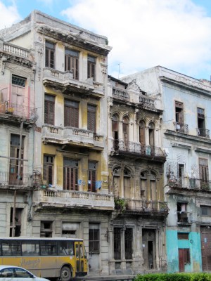 Although the facades are peeling and faded, I still see them as they once looked: pink, yellow and blue