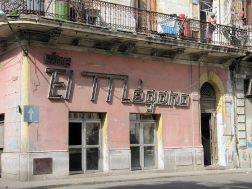 The El Megano Cinema is a shadow of its former self:  shabby and dark, it plays second-run films, sells cheap alcohol and attracts shady clientele who are as colourful as the pink and yellow facade was 40 years ago.