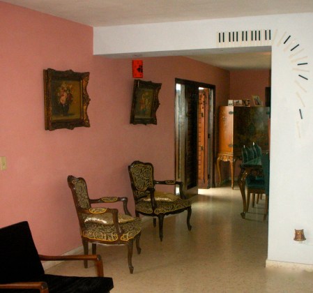 Inside a friendly local's home in Eastern Havana - 1920's chairs and a 1950's elevator. Nothing is new, everything is reused or recycled and perfectly kept.